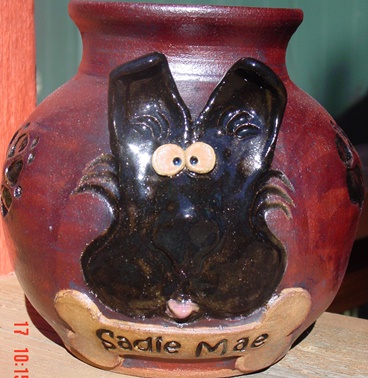 dog urn iron oxide stain, no glaze cartoon clay