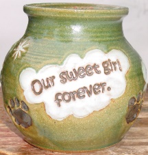 green pet urn with inscripted hearts